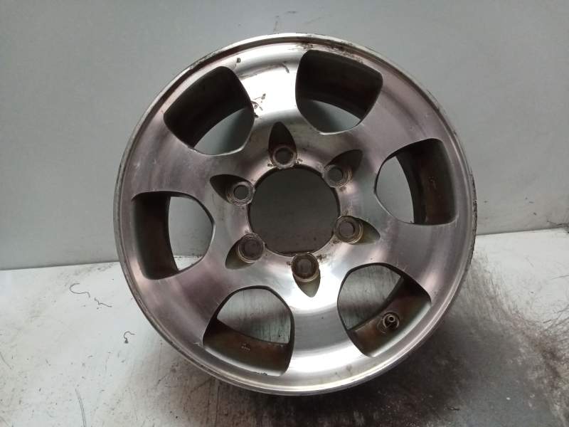 Recambio de llanta para mitsubishi montero (v20/v40) 2.5 turbodiesel referencia OEM IAM J15X6JJ ET33 CON CENTRO RAYADA